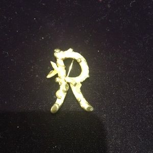 Gold initial “R” pin